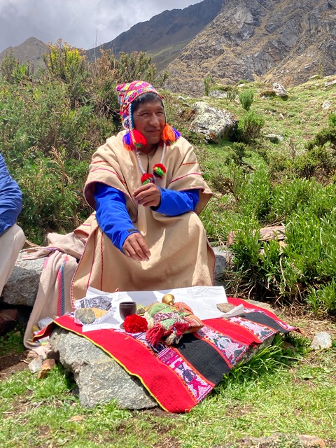 An Andean priest preparing offerings during a Pachamama ceremony in the Salkantay region of Peru