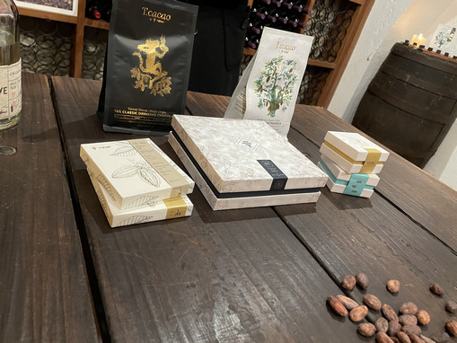 cacao beans on a table next to finished artisanal chocolates in ecuador