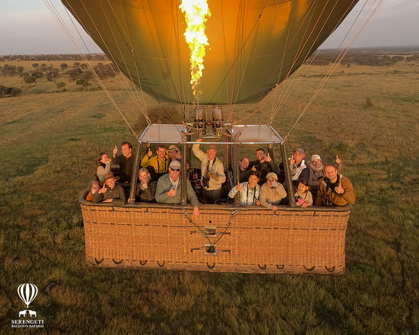 Is a hot air balloon in the Serengeti worth it? The smiles on these luxury safari guests in a hot air balloon in the Serengeti tell you the answer is a definite YES