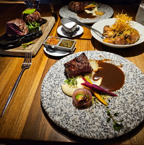 Main course at Mako Restaurant in Calafate, a smattering of artfully presented steaks and vegetables