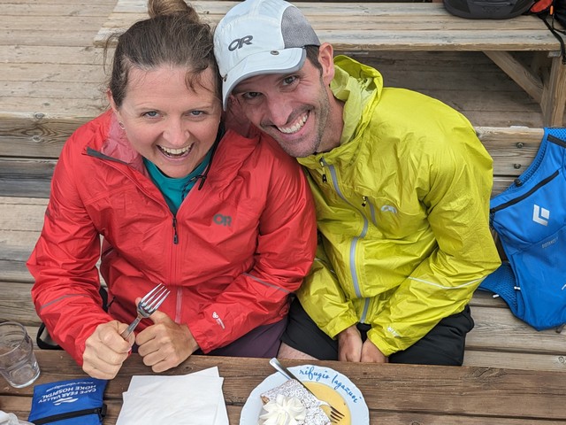 smiling couple seated at table