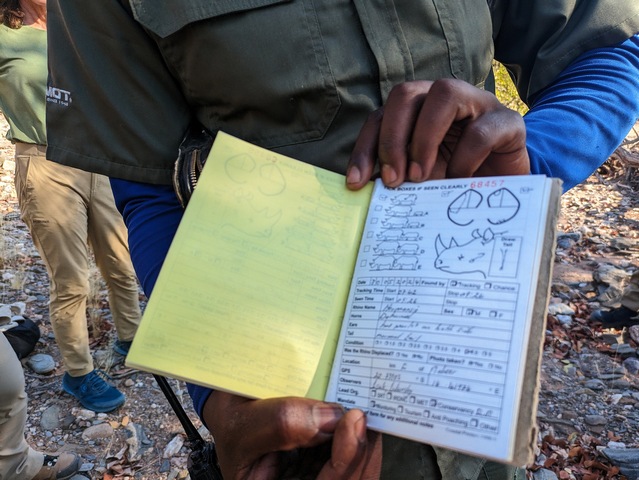 Notebook showing field notes of rangers who monitor and protect desert adapted black rhino in Namibia
