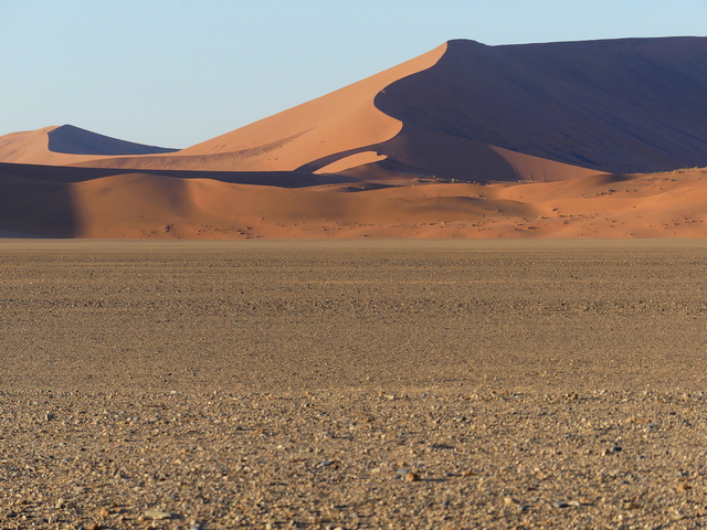 The vast sand dunes of Sossusvlei Namibia as seen at dawn during a luxury safari outing from Camp Sossus