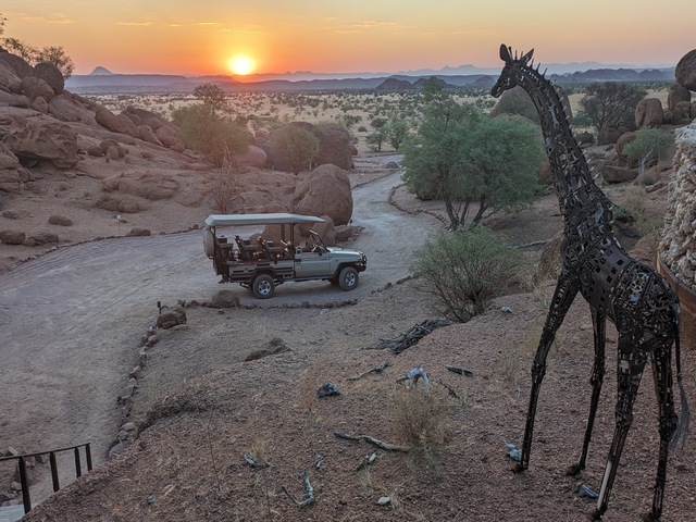 A safari vehicle headed out on a sunset drive at Onduli Ridge Camp in Damaraland Namibia