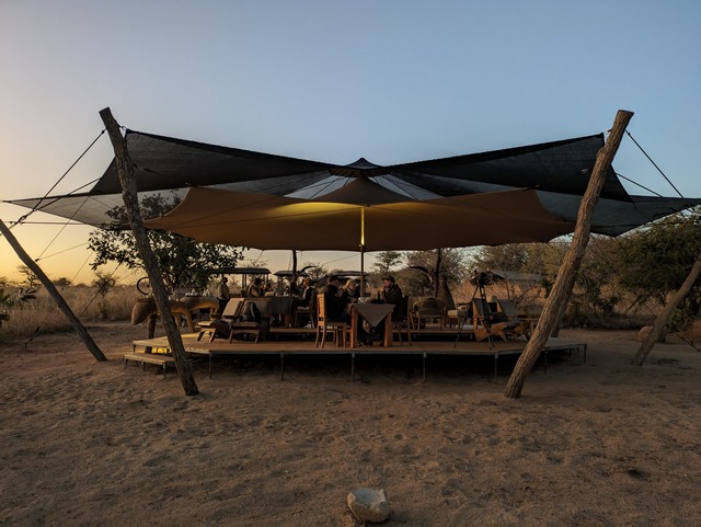 Open-air dining area under canvas at the ultra-exclusive Usangu Expedition Camp in Ruaha National Park Tanzania