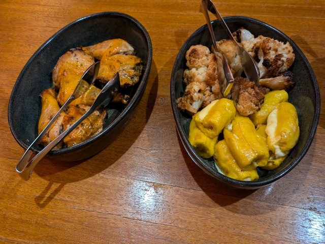 Two bowls of food on a dining table at Explora Ramaditas lodge