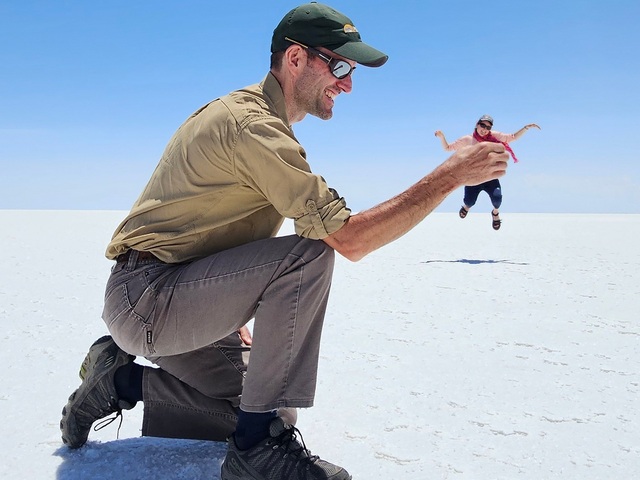 a perspective photo from the uyuni salt flats of a giant man