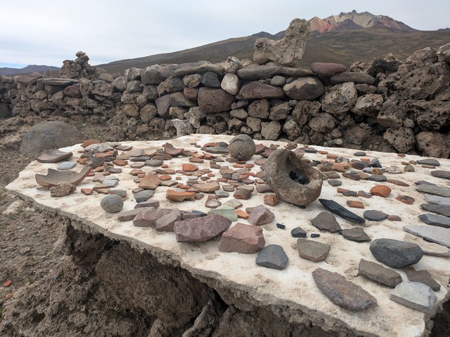 a table displaying potsherds and other artifacts at pukara ayque ruins