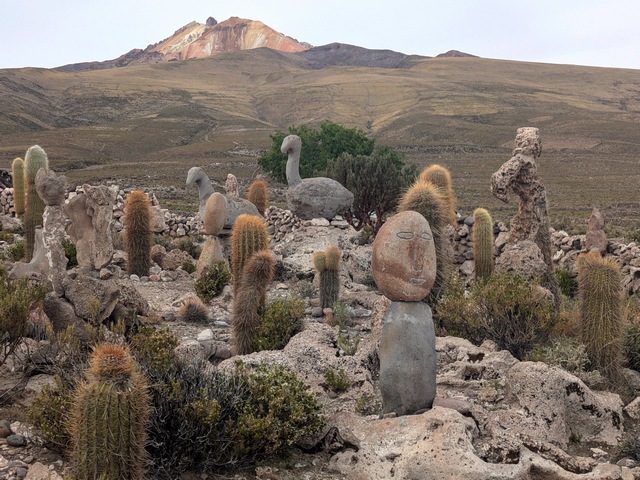 stone sculpture garden in chantani, with volcan tunupa in the background