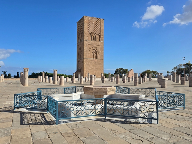 ornate fenced fountain with hassan tower in background in rabat morrocco