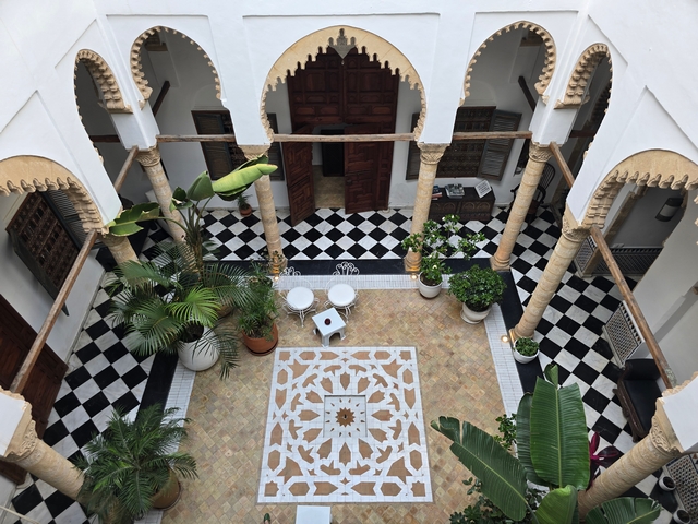 ornate tiled courtyard at a family-owned riad in morocco